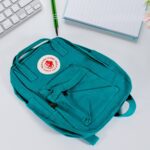 Durable Canvas Backpack, Conquer Your Day With King Kong (Mix Design) - Front View by Nari Haat, Indian ethnic wear, ...