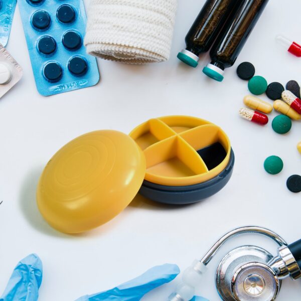 Portable Round Shape 4 Compartments Pill Box (1 Pc / With Color Box) - Front View by Nari Haat, Indian ethnic wear, w...