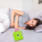 Green One-Eyed Monster Print Small Hot Water Bag with Cover for Pain Relief - Fabric Detail by Nari Haat, Indian ethn...