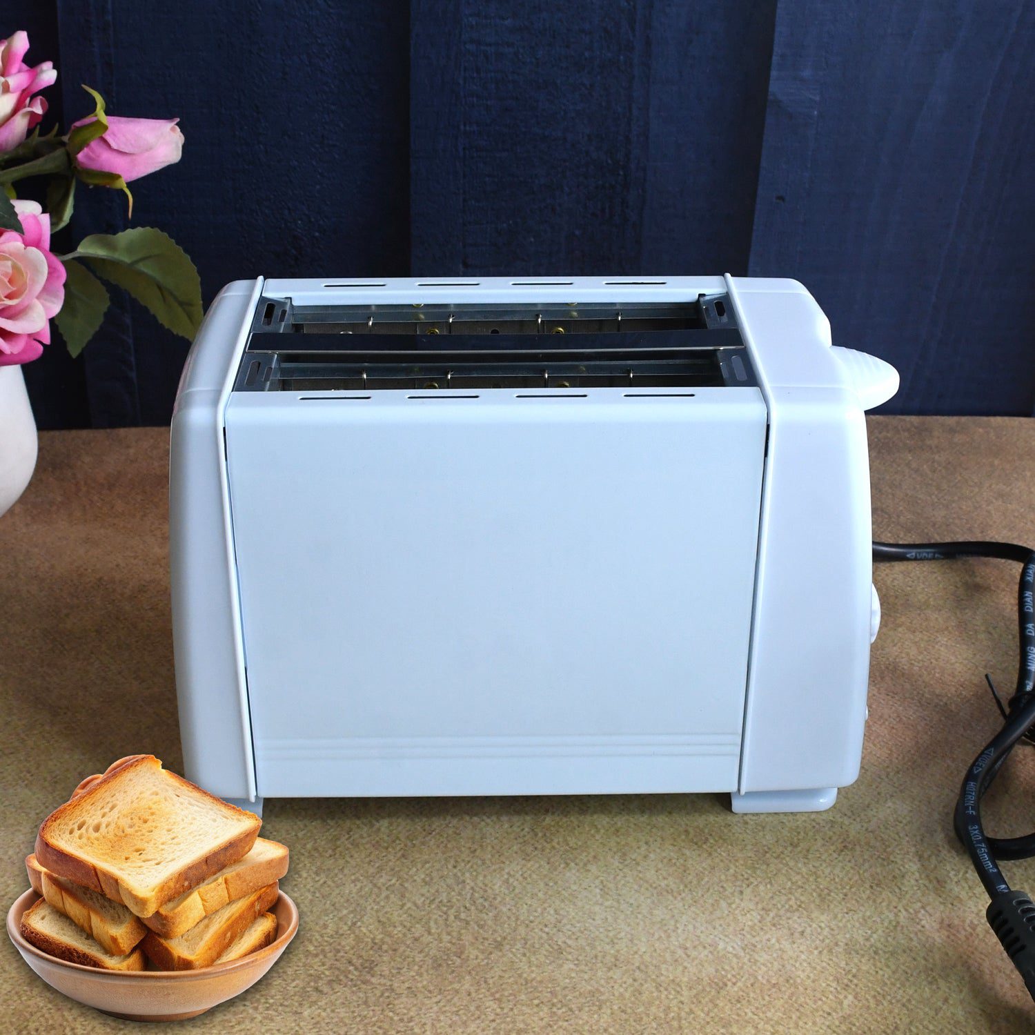 02_2009f1ac-4a5a-400a-a6c9-591be0469ede.jpg Electric Toaster Machine, Multifunctional Automatic Bread Machine (650 Watt / 1 Pc) - Front View by Nari Haat, Indian...