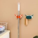 Multifunctional Cartoon Sticky Punch Free Mop Holder Wall Mounted Broom Organizer Cleaning Tools Holder Hanger, Self ...