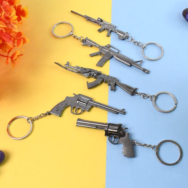 Mix Design Metal Gun Keychain With Case (1 Pc / Mix Design) - Front View by Nari Haat, Indian ethnic wear, women clot...