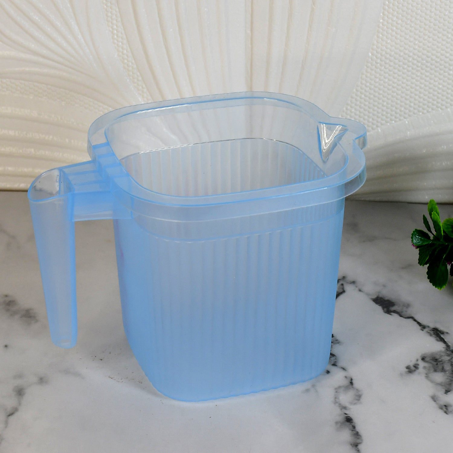 02_e826bb2c-6cc2-4e23-8b9b-e62eca9663f7.jpg Plastic Square Transparent Bath Water Mug (1 Pc / 1000 ML / Mix Color) - Front View by Nari Haat, Indian ethnic wear...