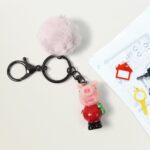 Cute Cartoon Keychain with Fluffy Pom (1 Pc / Mix Design) - Neckline Detail by Nari Haat, Indian ethnic wear, women c...
