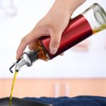 Glass Oil Dispenser with Plastic Covering, Oil and Vinegar Bottle (300 ml) - Neckline Detail by Nari Haat, Indian eth...