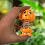 Cartoon Face, Spring Doll Dance Toy (1 Pc / With Color Box) - Neckline Detail by Nari Haat, Indian ethnic wear, women...