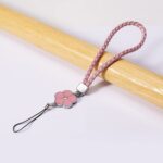 Flower Shape Metal Alloy Pendant with Braided Leather Hand Strap (1 Pc) - Neckline Detail by Nari Haat, Indian ethnic...