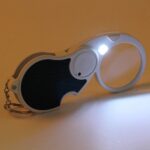 Double-Magnification Led Magnifiers Light Folding Keychain (1 Pc / Mix Color) - Fabric Detail by Nari Haat, Indian et...