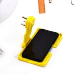 Multi-Purpose Wall Holder – Charging Stand for Mobile, Fits in Socket (1 Pc) - Fabric Detail by Nari Haat, Indian e...