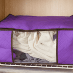 Clothing storage bag zipper, non-woven storage bag storing the clothes and sarees - Fabric Detail by Nari Haat, India...