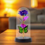 LED Preserved Rose with Colorful Butterfly in Plastic Dome (1 Pc & Mix Color) - Front View by Nari Haat, Indian ethni...