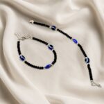 Adjustable Black Bead Evil Eye Protection Bracelet Set (2 Pc) - Neckline Detail by Nari Haat, Indian ethnic wear, wom...