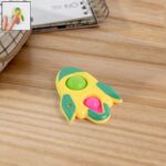 Rocket Shaped Dimple Keychain Toy (1 Pc) - Front View by Nari Haat, Indian ethnic wear, women clothing, designer suit