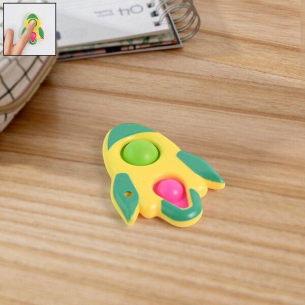 Rocket Shaped Dimple Keychain Toy (1 Pc) - Front View by Nari Haat, Indian ethnic wear, women clothing, designer suit