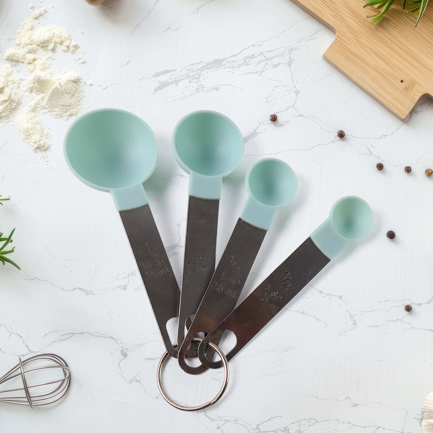 01_a388ceed-a109-4d2d-a331-cd769c2fca5a.jpg Premium Measuring Spoon Set with Stainless Steel Handles 4-Piece - Front View by Nari Haat, Indian ethnic wear, women...