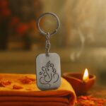 Auspicious Ganesh Cut-Out Metal Keychain - (1 Pc) - Front View by Nari Haat, Indian ethnic wear, women clothing, desi...