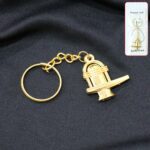 Shivling Golden Metal Keychain (1 Pc) - Front View by Nari Haat, Indian ethnic wear, women clothing, designer suit