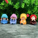 Decorative Resin Monk Buddha Showpiece Set of 4 with Traditional Straw Hats - Closeup Embroidery by Nari Haat, Indian...