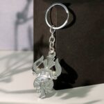 Trishul Damru Shiv Symbol Silver Keychain (1 Pc) - Closeup Embroidery by Nari Haat, Indian ethnic wear, women clothin...