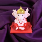 Decorative Small Lord Ganesh Idol in Transparent Case (1 Pc) - Front View by Nari Haat, Indian ethnic wear, women clo...