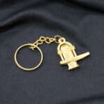 Shivling Golden Metal Keychain (1 Pc) - Closeup Embroidery by Nari Haat, Indian ethnic wear, women clothing, designer...