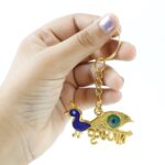 Krishna Peacock Design Golden Keychain (1 Pc) - Back View by Nari Haat, Indian ethnic wear, women clothing, designer ...