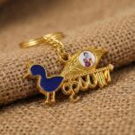 Premium Krishna-Themed Decorative Metal Keychain - Neckline Detail by Nari Haat, Indian ethnic wear, women clothing, ...