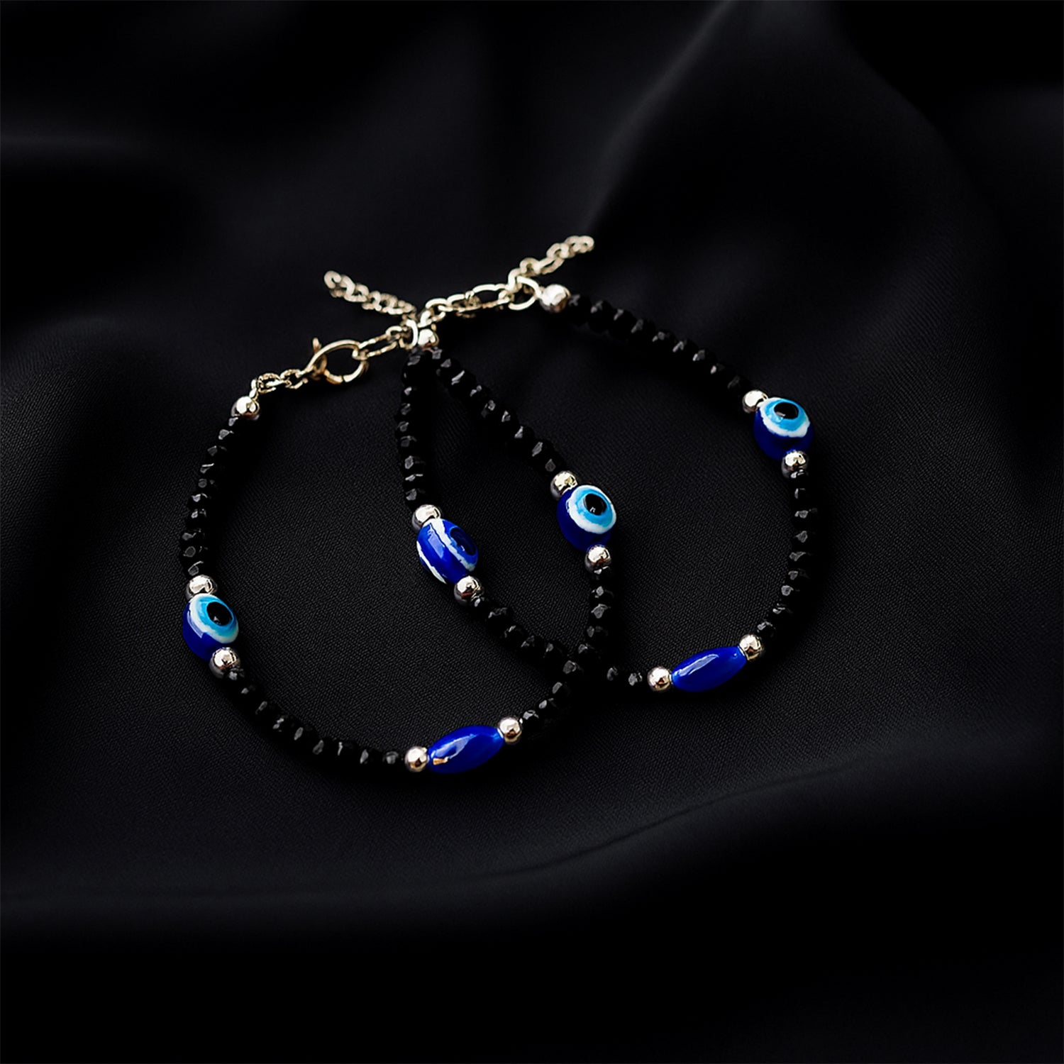 03_b2dd29d7-b9db-4d9e-83ec-a482307f16c0.jpg Adjustable Black Bead Evil Eye Protection Bracelet Set (2 Pc) - Front View by Nari Haat, Indian ethnic wear, women cl...