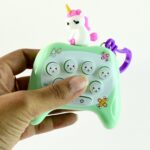 Cartoon Push-Button Musical Keychain Toy - (1 Pc) - Neckline Detail by Nari Haat, Indian ethnic wear, women clothing,...