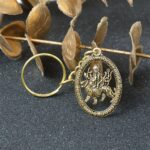 Maa Durga Oval Frame Golden Keychain (1 Pc) - Back View by Nari Haat, Indian ethnic wear, women clothing, designer suit