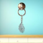 Stylish Stainless Steel Peacock Feather Keychain (1 Pc) - Back View by Nari Haat, Indian ethnic wear, women clothing,...
