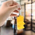 Plastic 2-in-1 Mobile Stand Keychain (1 Pc) - Neckline Detail by Nari Haat, Indian ethnic wear, women clothing, desig...