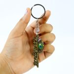 “Jai Shree Krishna” Text Metal Keychain (1 Pc) - Back View by Nari Haat, Indian ethnic wear, women clothing, desi...