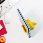 Multi-Functional Apple-Shaped Plastic Mobile Stand with Pen Holder (1 Pc / Mix Color) - Neckline Detail by Nari Haat,...