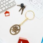 Premium Golden Metal Durga Maa Keychain (1 Pc) - Back View by Nari Haat, Indian ethnic wear, women clothing, designer...