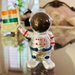 Solar Power Astronaut Ornament Moving Hand with Indian Flag (1 Pc) - Neckline Detail by Nari Haat, Indian ethnic wear...