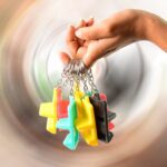 Plastic 2-in-1 Mobile Stand Keychain (9 Pc) - Sleeve Design by Nari Haat, Indian ethnic wear, women clothing, designe...