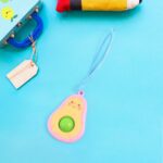Cute Avocado-Shaped Mini Push Pop Keychain Toy with Strap (1 Pc) - Back View by Nari Haat, Indian ethnic wear, women ...