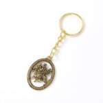 Maa Durga Oval Frame Golden Keychain (1 Pc) - Sleeve Design by Nari Haat, Indian ethnic wear, women clothing, designe...
