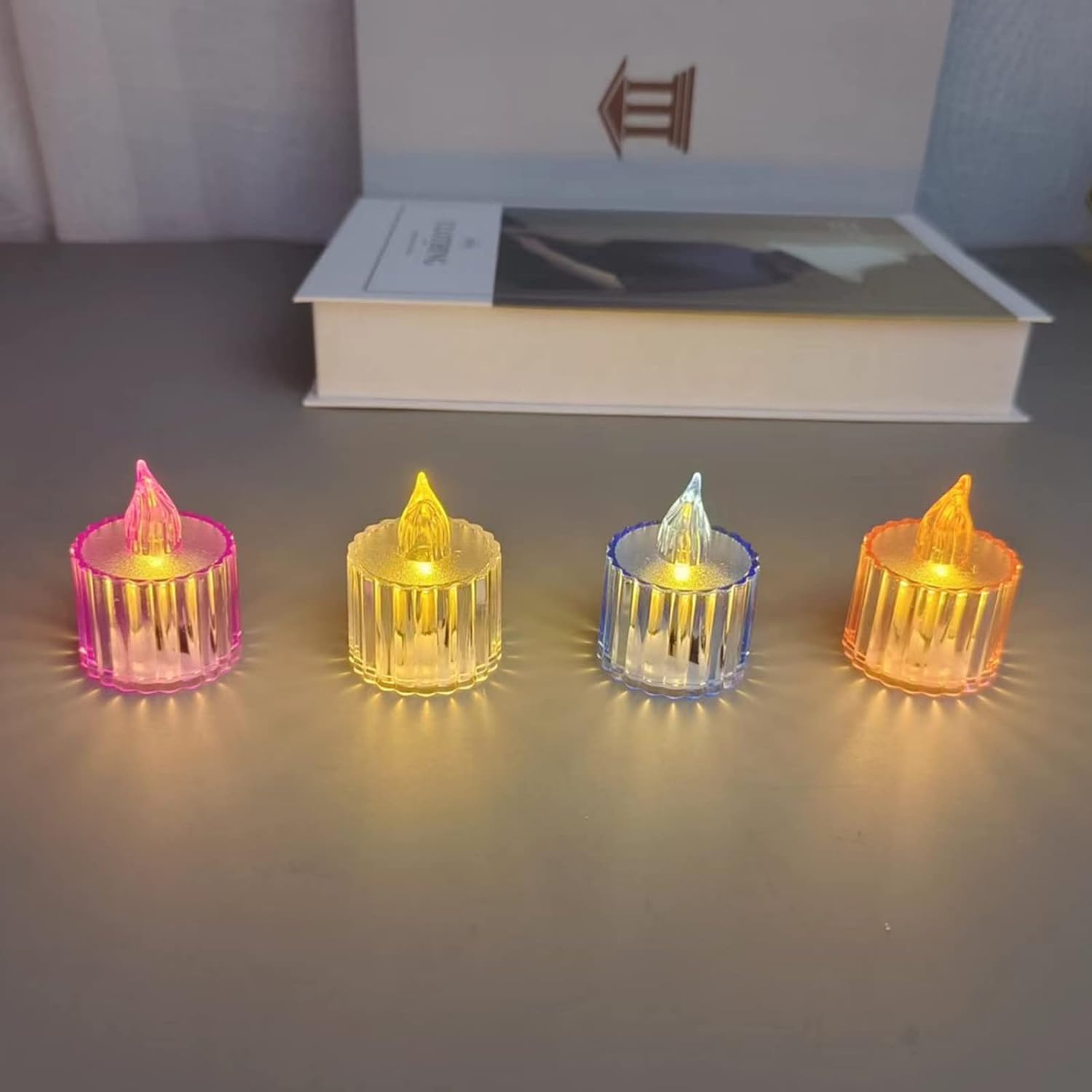 07_1e75ab29-4cc4-49c0-badf-6917660ab92f.jpg Flameless Acrylic LED Tealight Candles for Festival Decor (12 Pc) - Front View by Nari Haat, Indian ethnic wear, wome...