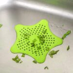 Star-shaped drain strainer for kitchen and bathroom sinks