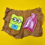 Minions Hot Water Bag - 2-Eye Design with Cover for Pain Relief & Warming - Back View by Nari Haat, Indian ethnic wea...