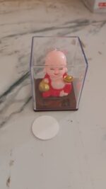 Solar Power Moving Head Buddha Statue Car Ornament (1 Pc / Mix Color) - Fabric Detail by Nari Haat, Indian ethnic wea...