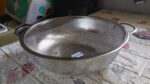 Stainless Steel Colander with Handle, Large Strainer Basket for Kitchen (25.5 cm) - Fabric Detail by Nari Haat, India...