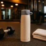 Creative Wheat Glass Water Bottle with Phone Holder (380ml) - Fabric Detail by Nari Haat, Indian ethnic wear, women c...