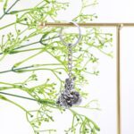 Premium Silver-Finish Metal Bal Krishna Eating Makhan Keychain (1 Pc) - Back View by Nari Haat, Indian ethnic wear, w...