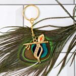 Flute and Peacock Feather Krishna Design Keychain (1 Pc) - Back View by Nari Haat, Indian ethnic wear, women clothing...