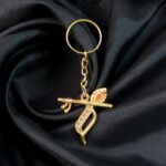 Flute and Peacock Feather Krishna Design Keychain (1 Pc) - Fabric Detail by Nari Haat, Indian ethnic wear, women clot...