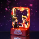 Romantic Couple Figurine with LED Light Showpiece (1 Pc) - Neckline Detail by Nari Haat, Indian ethnic wear, women cl...