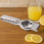 Supermom 2-in-1 Heavy Duty Stainless Steel Lemon Squeezer with Built-in Bottle Opener - Front View by Nari Haat, Indi...